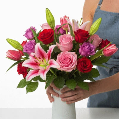 Beautiful bouquet of fresh, vibrant flowers being prepared for delivery
